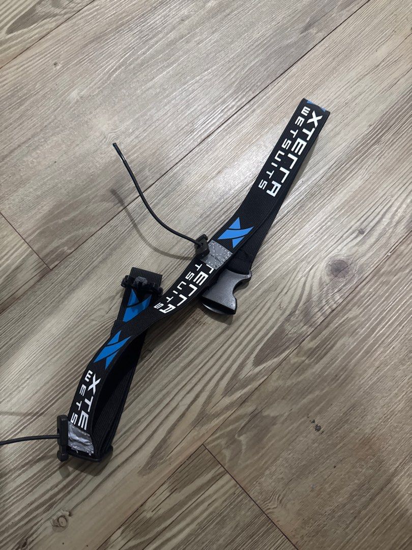 Xterra race belt Strap (Category: Rash guard) located in Santa Rosa. Submitted by mooseproject (Listing ID 1412077055, Image 1). Description: - Xterra race belt Strap - Black and blue color scheme - Includes a buckle for secure fastening - Features an attached cord.