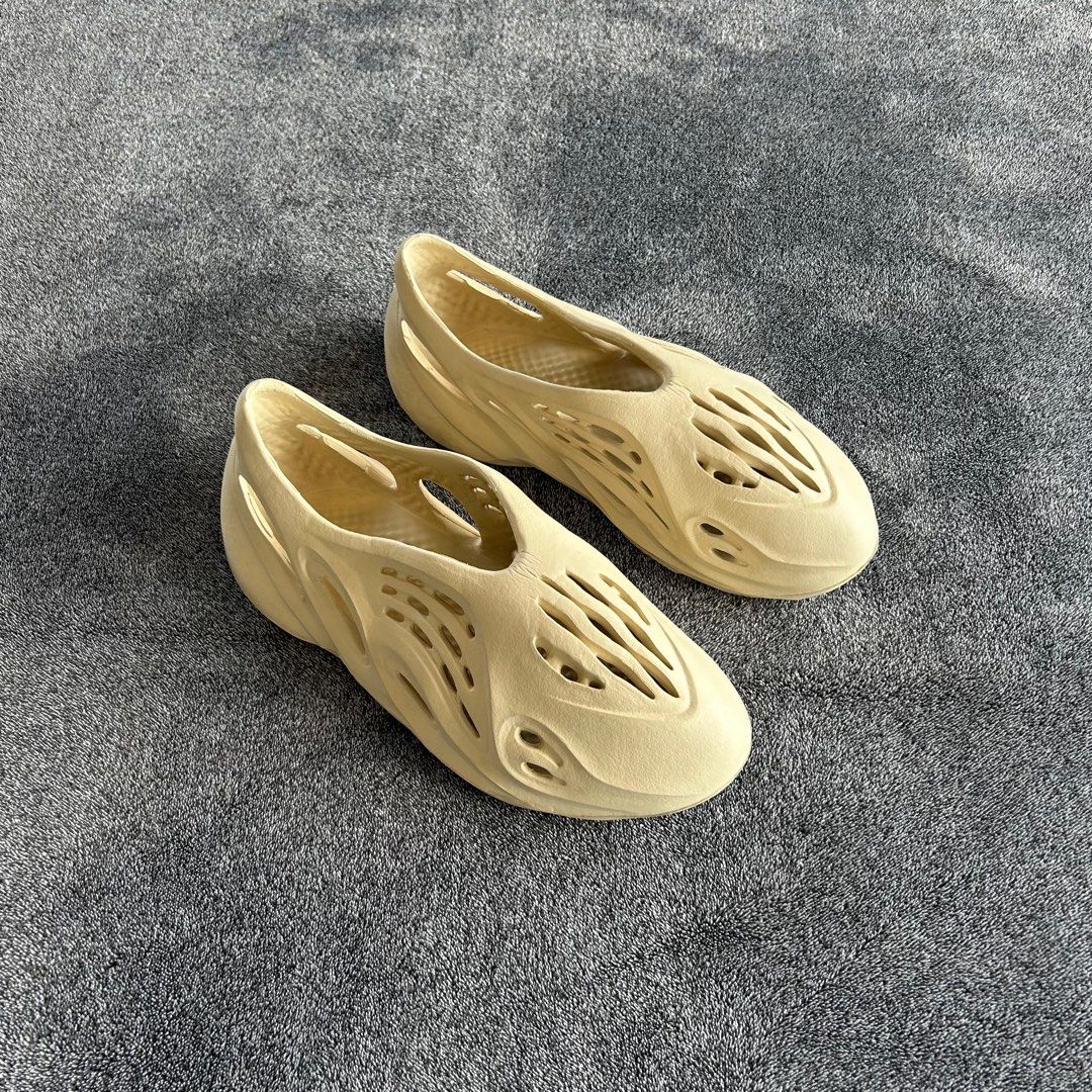 Yezzy Foam Runner Clogs - Cream Beige (Category: Slippers & Slides) located in Quezon City. Submitted by nowthatslegitph (Listing ID 1412027615, Image 1). Description: Sizing on Item: US 10.5 UK 9.5 EU 44 - Cheap alternative to Adidas Yeezy Foam Runners (Bone or Desert Sand) - Neutral cream or beige color - Signature foam construction - Multiple ventilation holes - Slip-on design - Clean soles - Well-maintained shape.