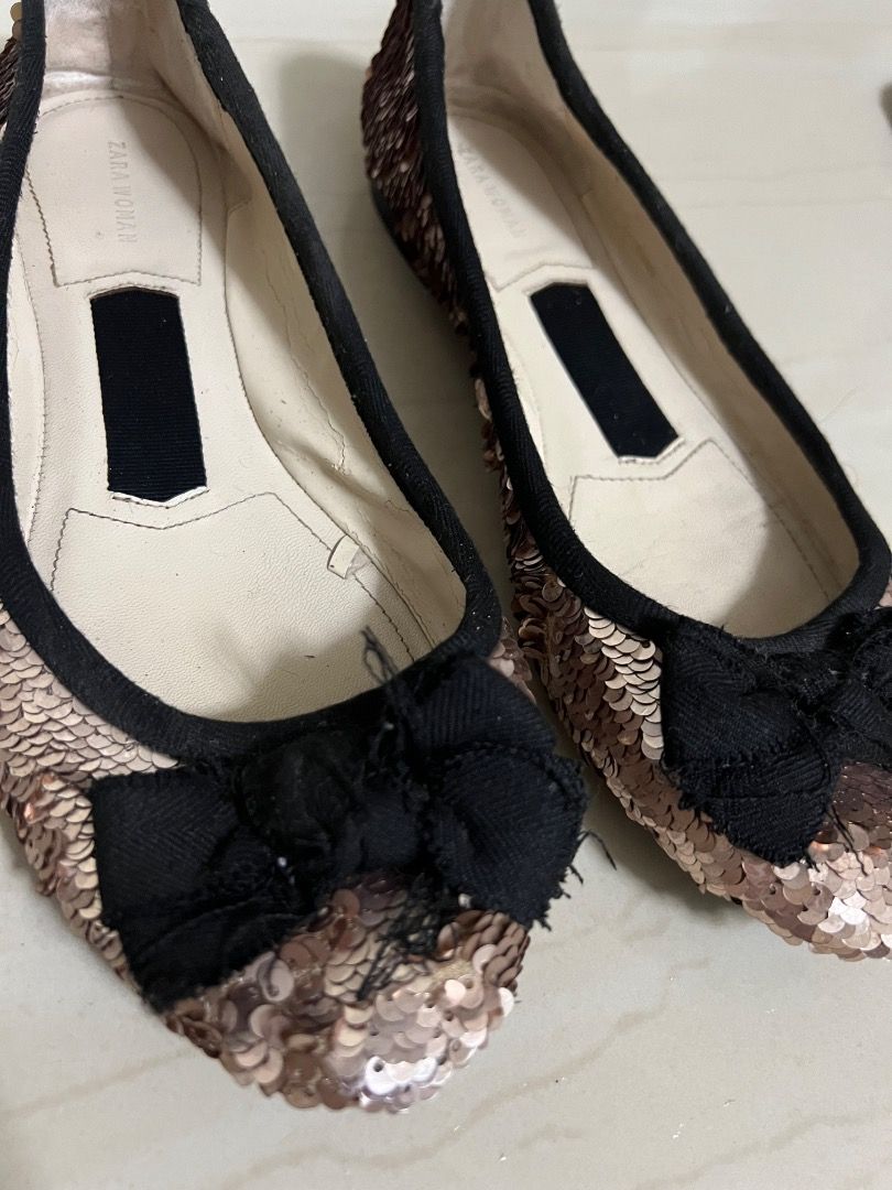 ZARA flats (Category: Flats & Sandals) located in Manila. Submitted by cluttercrushers (Listing ID 1411986188, Image 2). Description: - Zara sequined ballet flats in a rose gold color with a black bow - Mettalic commuter flats - Good condition .