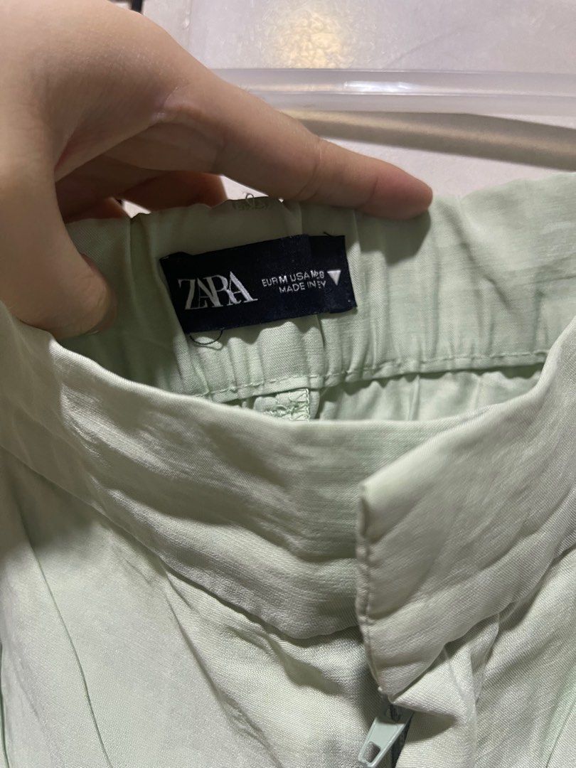 Zara Green Shorts - Size M (Category: Shorts) located in Quezon City. Submitted by lespyjamas (Listing ID 1411992925, Image 2). Description: - Zara green shorts - High-waisted with pleats - Size: M - Zipper and button closure - Made in Turkey - Perfect for a casual and chic style.