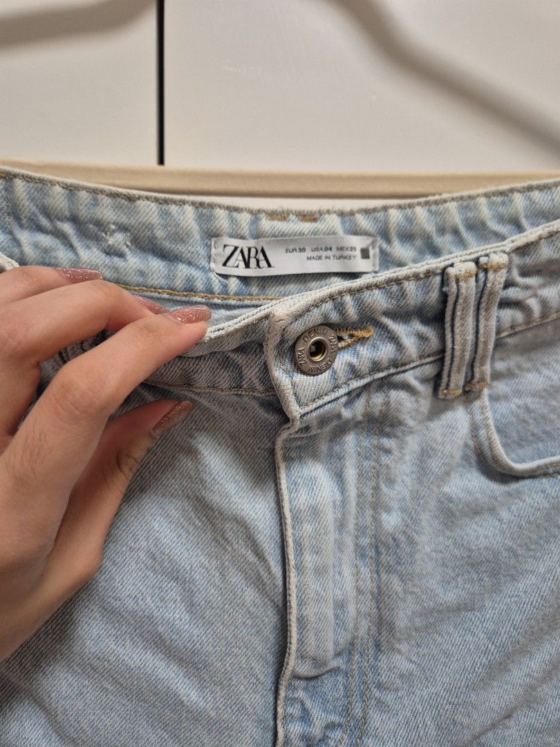 Zara Light Wash Denim Shorts (Category: Shorts) located in Antipolo. Submitted by declutteringkingking (Listing ID 1412022220, Image 2). Description: - Zara light blue denim shorts - Button closure - Front and back pockets - Rolled hem - Size tag visible - Perfect for casual wear.