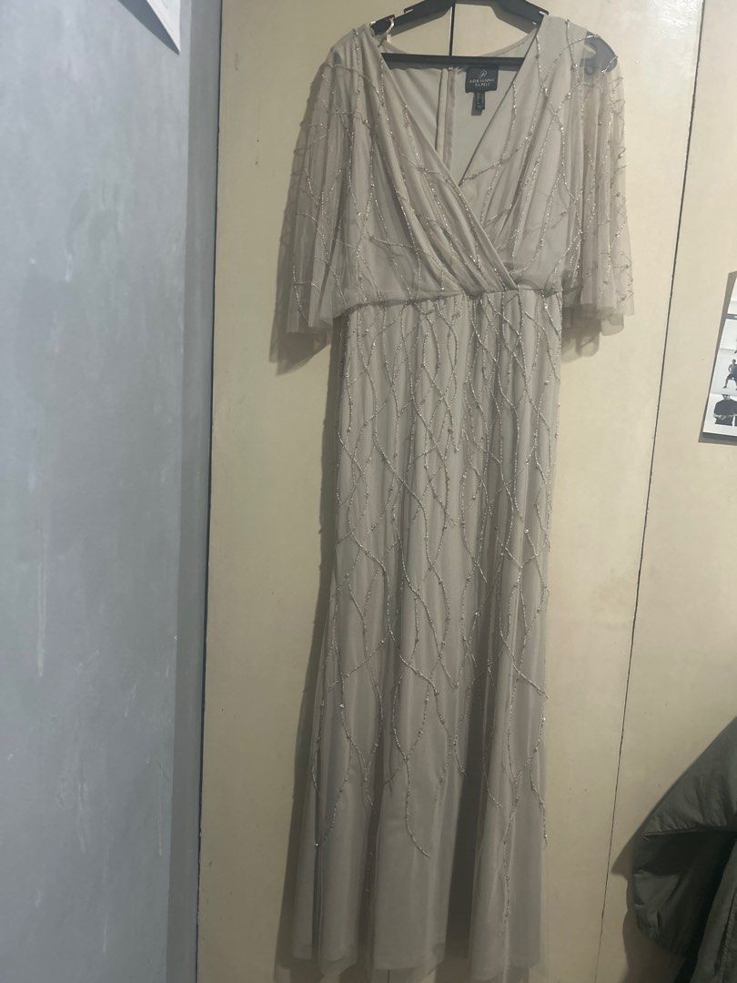 Adrianna Papell Beaded Gown (Category: Evening dresses & gowns) located in Manila. Submitted by goodluckstuff (Listing ID 1412147240, Image 1). Description: Adrianna Papell beaded gown. Wrap style with flowy skirt. Very nice for weddings and other formal ocassions. Condition: Minor beadwork imperfections see pics 5 and 6, barely visible when worn. - Size: US 6 - Color: Neutral This gown is very beautiful when worn. The color is soft neutral perfe