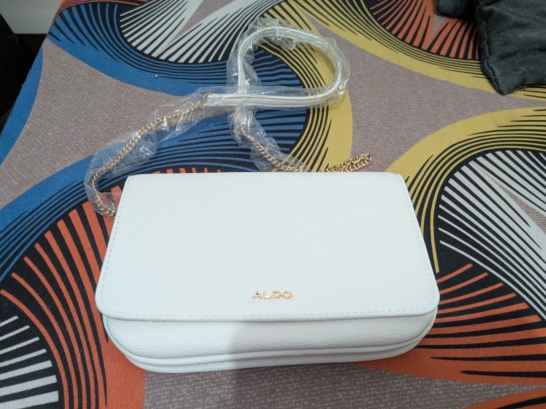 Aldo Riverly White Crossbody Bag (Category: Cross-body Bags) located in Manila. Submitted by jinjol (Listing ID 1412166691, Image 3). Description: - Brand new Aldo bag, gift lang sa akin pero I prefer tote bags. Or swap sa tote bag. - DM po. :) Valenzuela loc..