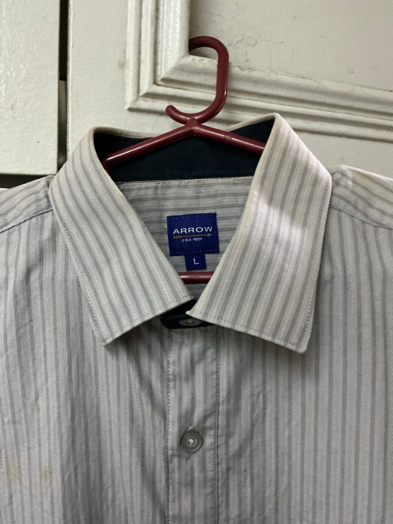 Arrow Striped Long Sleeve Shirt - Large (Category: Tshirts & Polo Shirts ) located in Manila. Submitted by harbs05 (Listing ID 1412254086, Image 2). Description: - Arrow long sleeve shirt - Size: Large - Design: Vertical stripes - Style: Button-down front with classic collar - Features: Chest pocket and buttoned cuffs - Color: Neutral, versatile for various occasions.