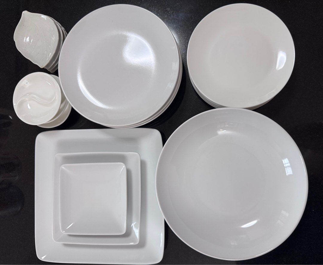 Assorted Dinnerware Set (Category: Dinnerware & Cutlery) located in Singapore. Submitted by yojuju (Listing ID 1412288824, Image 1). Description: Versatile collection of white dinnerware, perfect for everyday use or special occasions. Includes various plate sizes, bowls, and serving dishes. Clean and ready to use. Some pieces have unique shapes and designs. Exact price to be negotiated depends on what you need!.