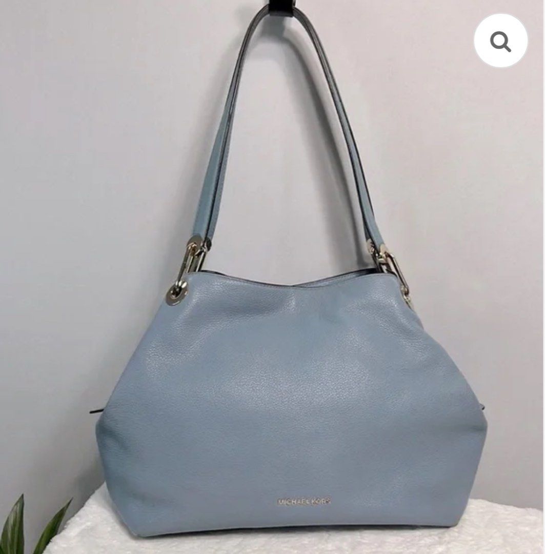 Authentic Michael Kors Raven Large Pebbled Leather Shoulder Bag (Category: Luxury Bags & Wallets) located in Quezon City. Submitted by sherashley (Listing ID 1412227015, Image 3). Description: - Michael Kors Raven shoulder bag - Blue pebbled leather - Gold-tone hardware - Double shoulder straps - Zip closure - Interior: zip pocket and slip pockets - Protective metal feet - Size: height 10.5 inch(size of the strap not included) 15 inch(width) 8 in