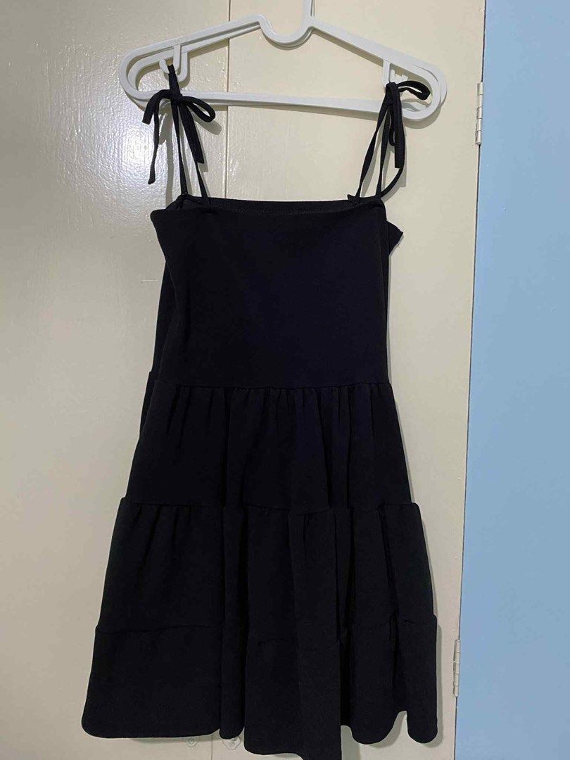 Black Tiered Dress with Tie Straps (Category: Dresses) located in Manila. Submitted by mackyrena (Listing ID 1412281077, Image 1). Description: - Black tiered dress - Tie straps - Square neckline - Flowy skirt - Lightweight fabric - Perfect for warm weather.
