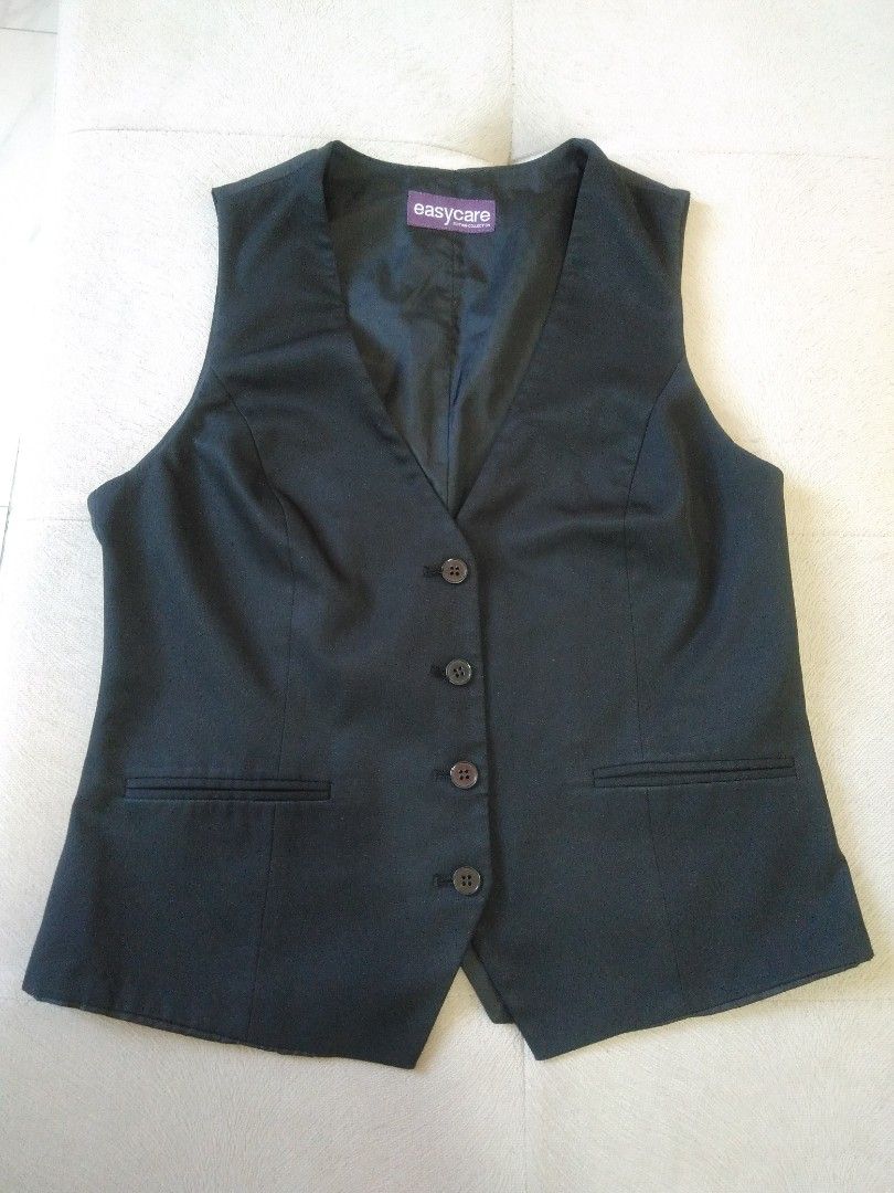 Black Waistcoat/Vest (Category: Vests) located in Marikina City. Submitted by newowners2025 (Listing ID 1412154562, Image 2). Description: Length: 21 in Bust: 33-34 in Waist: 26-27 in - Classic black vest - V-neck design - Button-down closure - Two front pockets (design only) - Tailored fit - Versatile for layering .