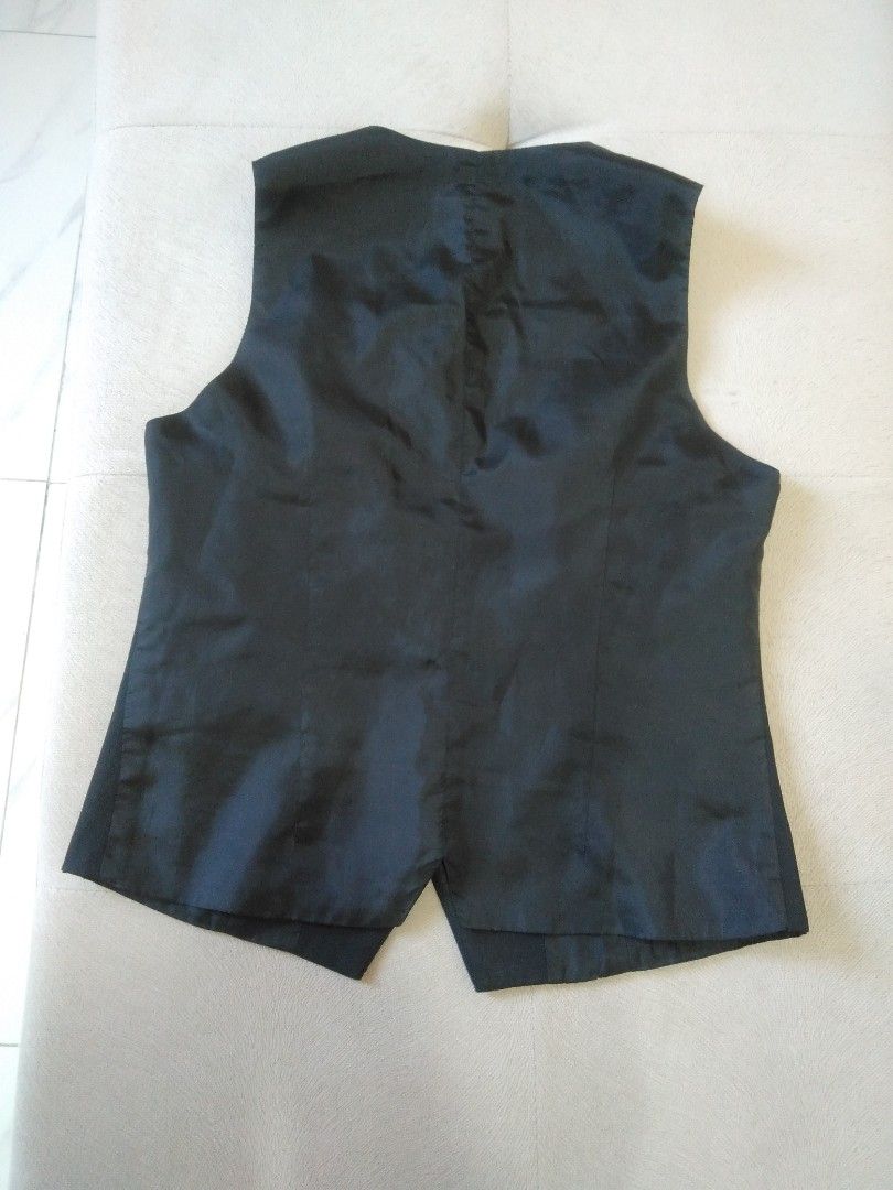 Black Waistcoat/Vest (Category: Vests) located in Marikina City. Submitted by newowners2025 (Listing ID 1412154562, Image 3). Description: Length: 21 in Bust: 33-34 in Waist: 26-27 in - Classic black vest - V-neck design - Button-down closure - Two front pockets (design only) - Tailored fit - Versatile for layering .