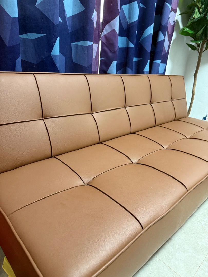 Brown Leather Sofa Bed from Mandaue Foam (Category: Sofas) located in Manila. Submitted by marasigan.erwin44 (Listing ID 1412213729, Image 1). Description: - Brown leather sofa bed - Tufted design - Modern aesthetic - Converts from sofa to bed - Ideal for small spaces - Durable leather upholstery - Sturdy frame Brown Leather sofa bed from mandaue foam bought last January 2025. Almost brand new in pristine condition. Rfl. Need funds for renovation