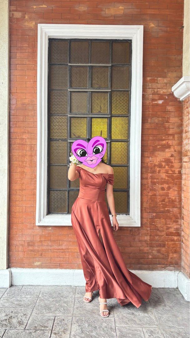 Brown Off-Shoulder Formal Maxi Dress (Category: Dresses) located in Cavite. Submitted by luwyella (Listing ID 1412320056, Image 1). Description: - Thigh-high slit - Fitted bodice -with 2 pockets - Flowing skirt - Suitable for formal events - Floor-length - Satin-like fabric -my stats for reference: 5’6 Bust 34 Waist 30 .