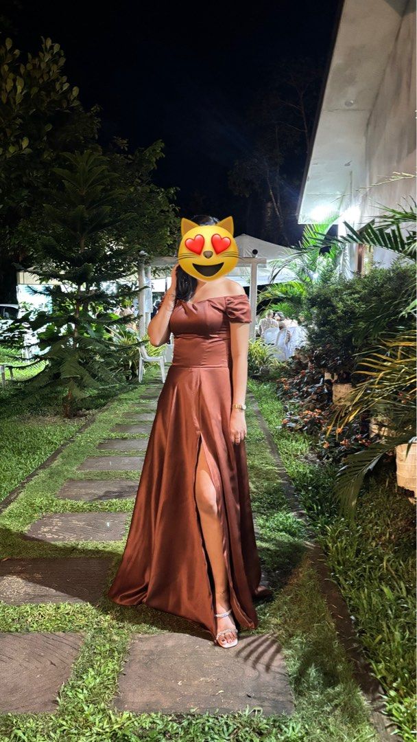 Brown Off-Shoulder Formal Maxi Dress (Category: Dresses) located in Cavite. Submitted by luwyella (Listing ID 1412320056, Image 2). Description: - Thigh-high slit - Fitted bodice -with 2 pockets - Flowing skirt - Suitable for formal events - Floor-length - Satin-like fabric -my stats for reference: 5’6 Bust 34 Waist 30 .