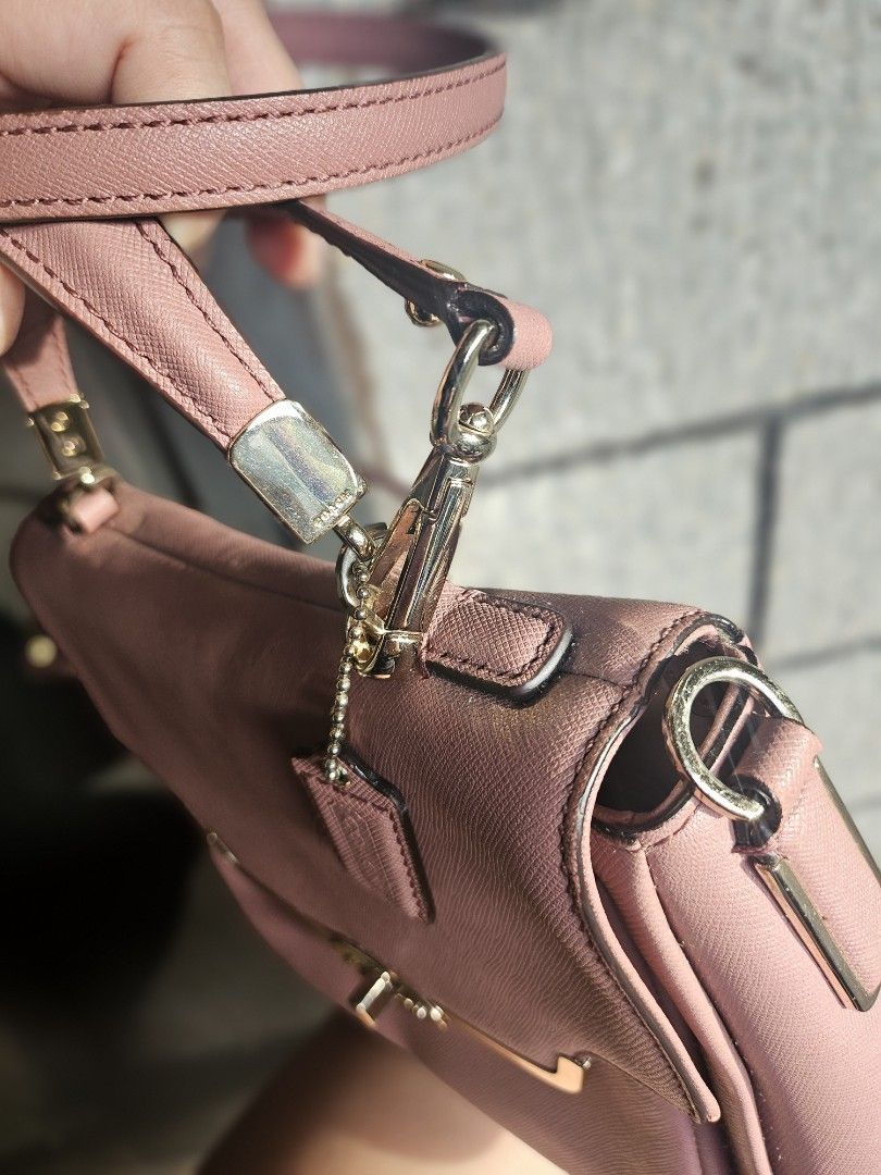 Coach Pink Crossbody Bag (Category: Luxury Bags & Wallets) located in Iloilo. Submitted by bagsdotilo (Listing ID 1412305642, Image 3). Description: - Authentic Coach crossbody bag - Pink leather exterior - Gold-tone hardware - Top handle and detachable shoulder strap - Multiple interior compartments (zippered and slip pockets) - Includes Coach tag.