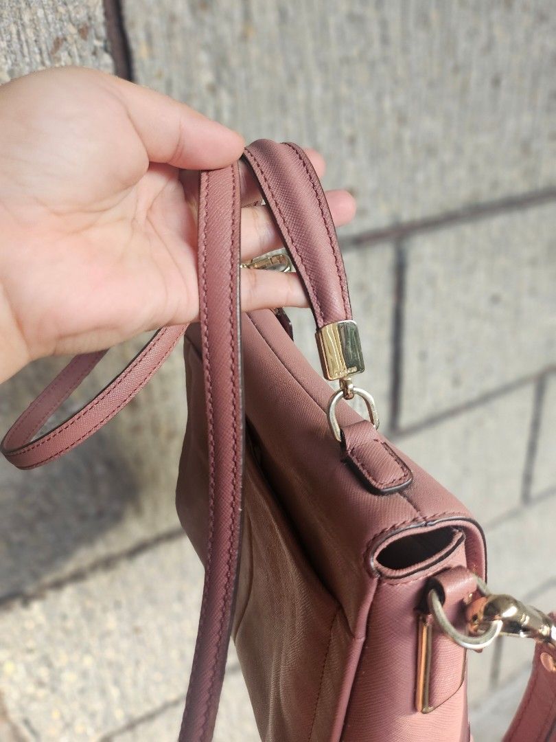 Coach Pink Crossbody Bag (Category: Luxury Bags & Wallets) located in Iloilo. Submitted by bagsdotilo (Listing ID 1412305642, Image 2). Description: - Authentic Coach crossbody bag - Pink leather exterior - Gold-tone hardware - Top handle and detachable shoulder strap - Multiple interior compartments (zippered and slip pockets) - Includes Coach tag.