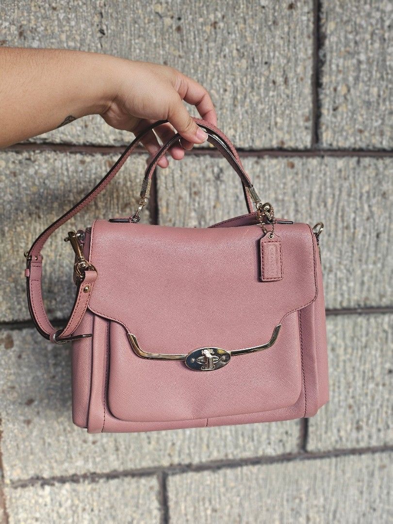 Coach Pink Crossbody Bag (Category: Luxury Bags & Wallets) located in Iloilo. Submitted by bagsdotilo (Listing ID 1412305642, Image 1). Description: - Authentic Coach crossbody bag - Pink leather exterior - Gold-tone hardware - Top handle and detachable shoulder strap - Multiple interior compartments (zippered and slip pockets) - Includes Coach tag.