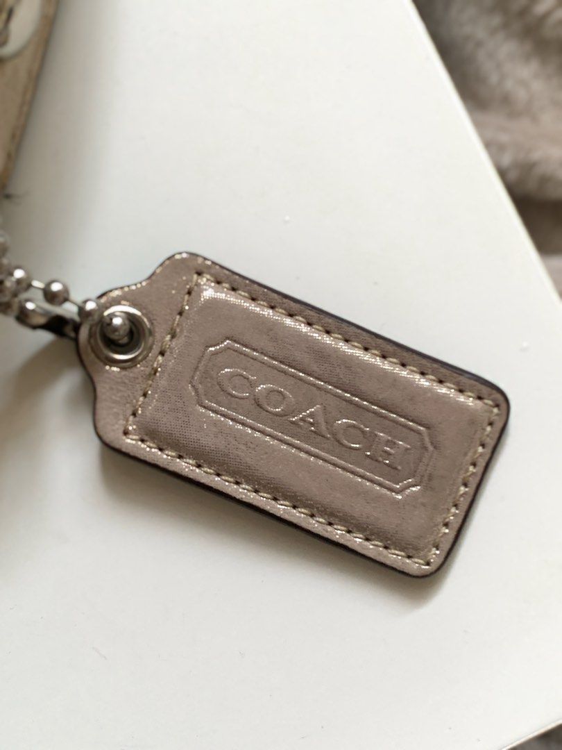 Coach Shoulder Bag (Category: Luxury Bags & Wallets) located in Quezon City. Submitted by styleclassy (Listing ID 1412140145, Image 2). Description: Metallic beige Gold color in silver hardware Flap closure with buckle detail. Interior lined with light purple fabric Made in Vietnam, bought in Japan. Vintage Coach. Can provide box for a more luxurious unboxing. Please DM only if interested .