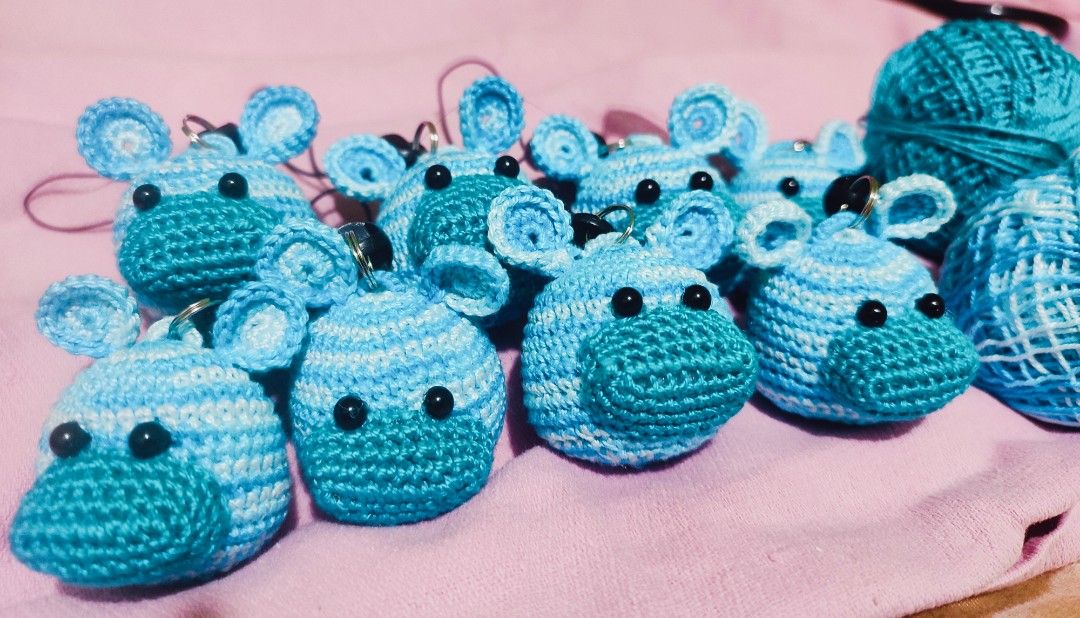 Crochet Hippo phone charm (Category: Handmade Craft) located in Valenzuela. Submitted by pixieworks64309 (Listing ID 1412280287, Image 2). Description: - Handmade crochet hippo keychains/phone charms - Available in various shades of blue - Features detailed hippo head design - Includes a loop for attaching keys or to attached into your mobile case - Adds a unique touch to your keys or bags - Crafted with care and attention to detail.