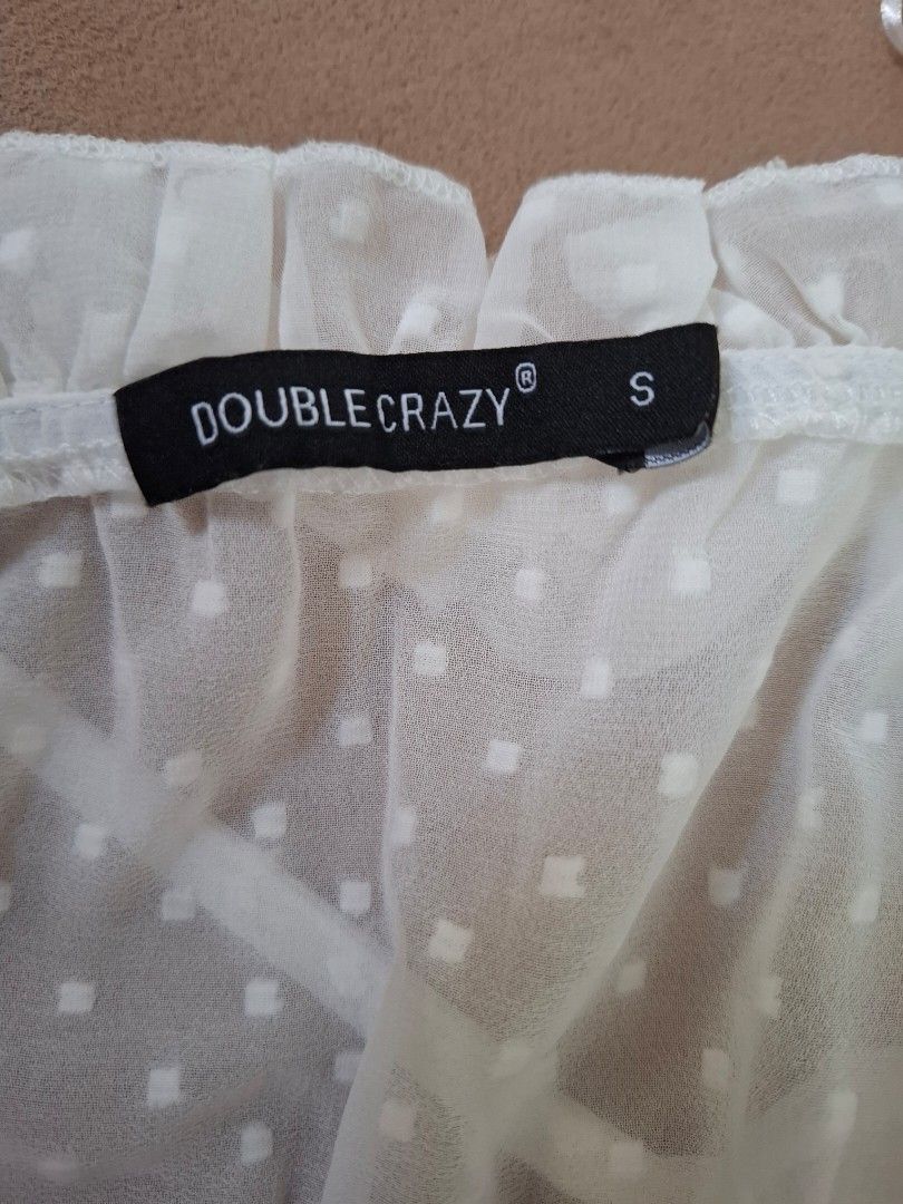 Double Crazy Off-Shoulder Dress - Size S (Category: Babies & Kids Fashion) located in Cavite. Submitted by l.m.m. (Listing ID 1412160502, Image 2). Description: - Double Crazy off-shoulder dress - Size: Small - Features: - Ruffled neckline - Ruffled hem - Waist tie - Subtle polka dot pattern - Waist measurement: Approximately 12 inches.