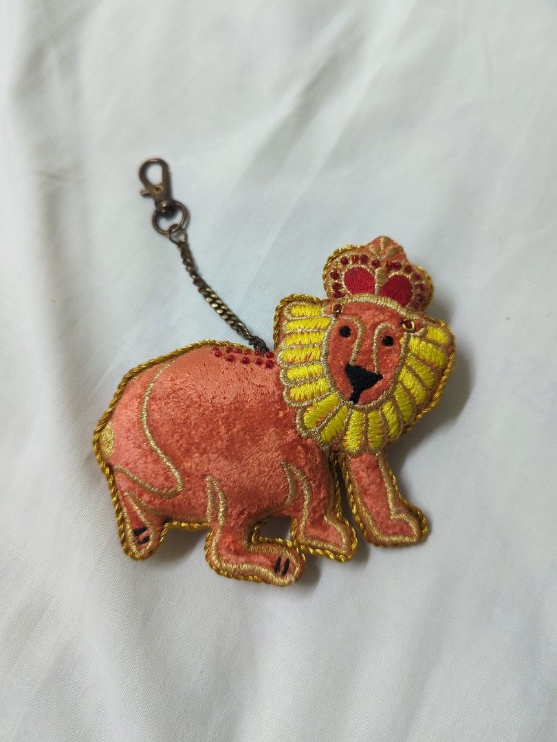 Embroidered Lion Keychain (Category: Plushies & Soft Toys) located in Taguig. Submitted by hlco13 (Listing ID 1412321765, Image 1). Description: - Adorable embroidered lion keychain - Includes chain and clasp - Easy to attach to keys or bags - Features a yellow mane and red crown - Unique and eye-catching accessory.