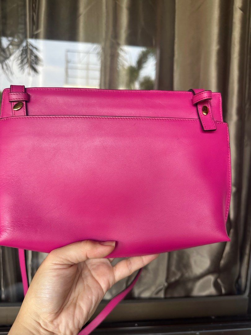 Guaranteed authentic Loewe Crossbody (Category: Luxury Bags & Wallets) located in Manila. Submitted by mysweetcorner (Listing ID 1412201715, Image 2). Description: With Entrupy and orig dustbag Smooth leather with clean interior Gold hardware with cute Loewe logo accents Flaw: strap at the back was removed (see pic) does not affect functionality of the bag and can still be inserted back in the slot .