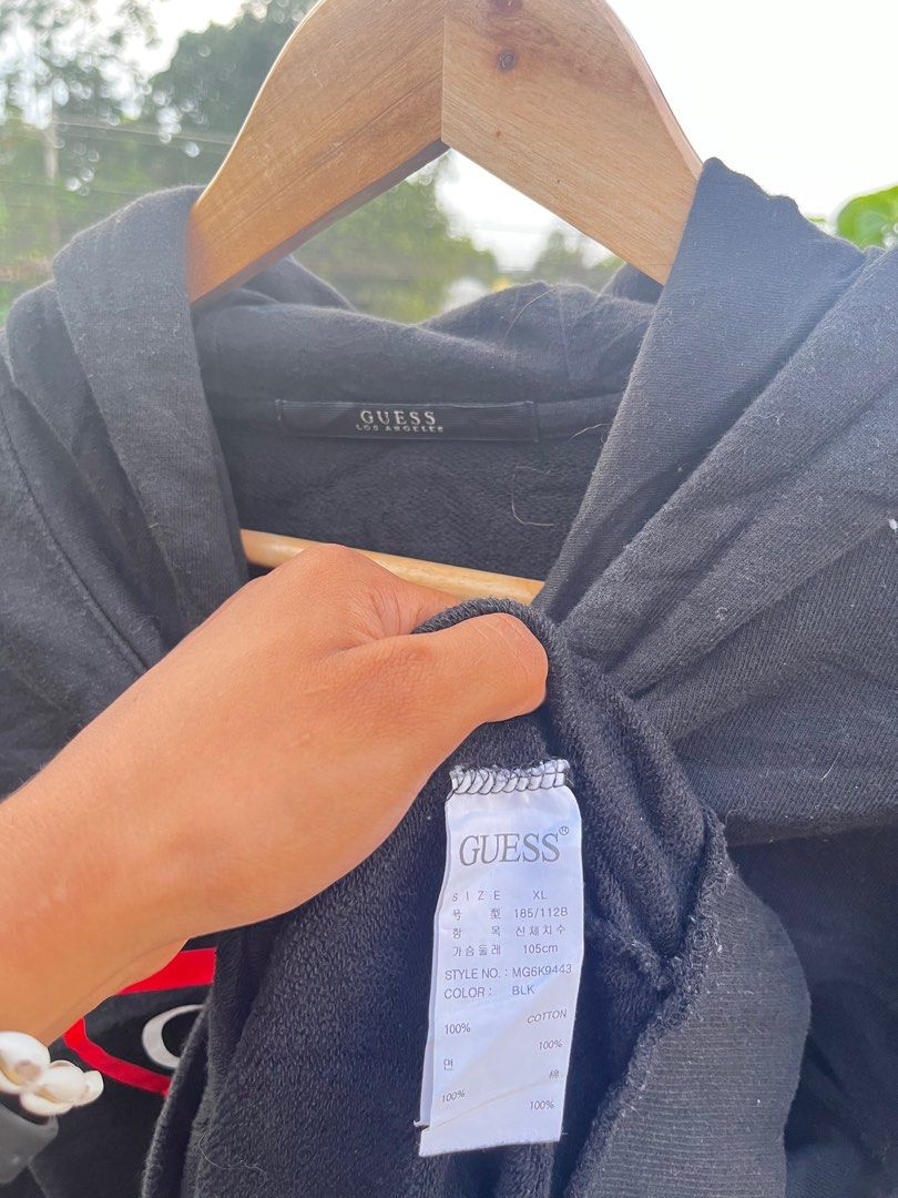 Guess Black Hoodie XL (Category: Hoodies) located in Mahayag. Submitted by kyle_thrift (Listing ID 1412328558, Image 2). Description: - Black Guess hoodie - Size: XL - Features red triangle logo - Color: Black - Material: 100% cotton - Classic design - Perfect for casual wear.