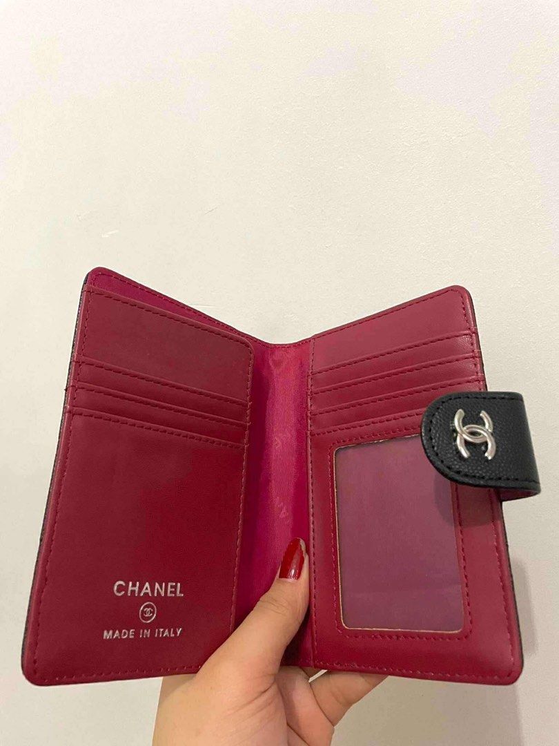 GWP Ch***el Quilted Wallet/Passport holder (Category: Luxury Accessories) located in Paranaque City. Submitted by lca520 (Listing ID 1412164800, Image 2). Description: -Gift With Purchase -Unused, no box - Authentic Ch***el wallet/passport holder - Black quilted exterior - Snap closure - Red interior - Multiple card slots - Clear ID window - Chanel logo visible - Made in Italy MOP:BPI, GCash.