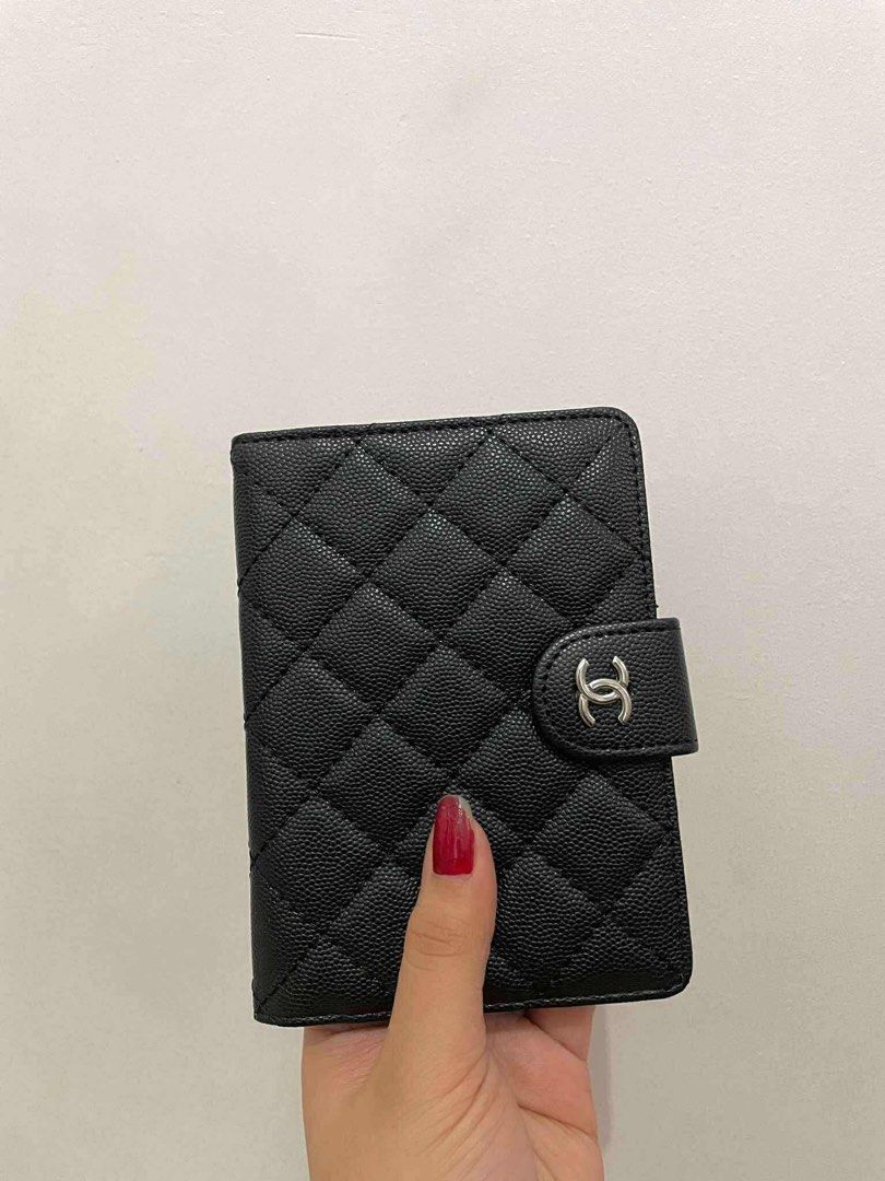 GWP Ch***el Quilted Wallet/Passport holder (Category: Luxury Accessories) located in Paranaque City. Submitted by lca520 (Listing ID 1412164800, Image 3). Description: -Gift With Purchase -Unused, no box - Authentic Ch***el wallet/passport holder - Black quilted exterior - Snap closure - Red interior - Multiple card slots - Clear ID window - Chanel logo visible - Made in Italy MOP:BPI, GCash.