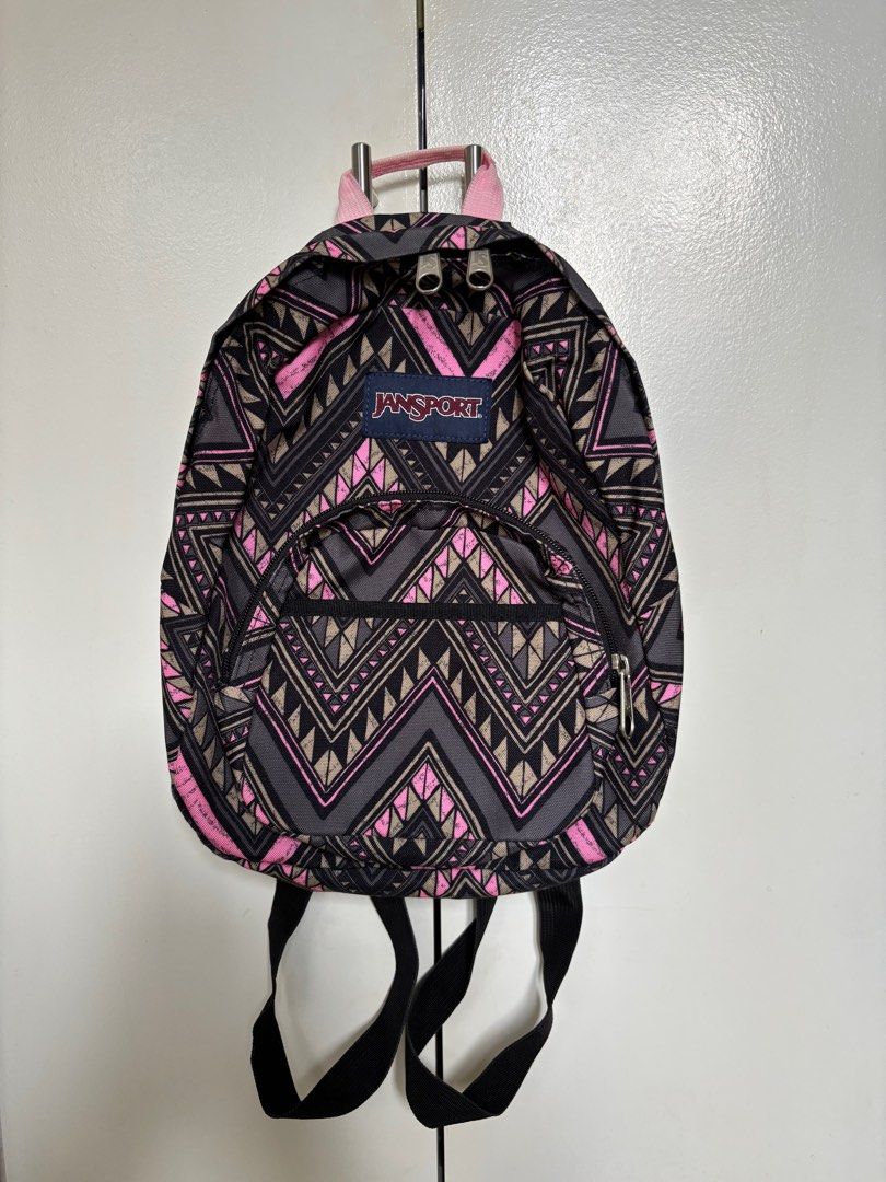 Jansport Mini Backpack (Category: Backpacks) located in Quezon City. Submitted by briesells (Listing ID 1412199904, Image 1). Description: RFS: Decluttering, di ko na nagagamit Negotiable! (: PM me Details: - Brand: Jansport - Mini backpack - Color: pink and brown Aztec design - 3 pockets: main pocket, zipper front pocket with keyring, velcro front pocket - Minor flow: bag hook pink color has slightly faded (see last photo) See my account bio for
