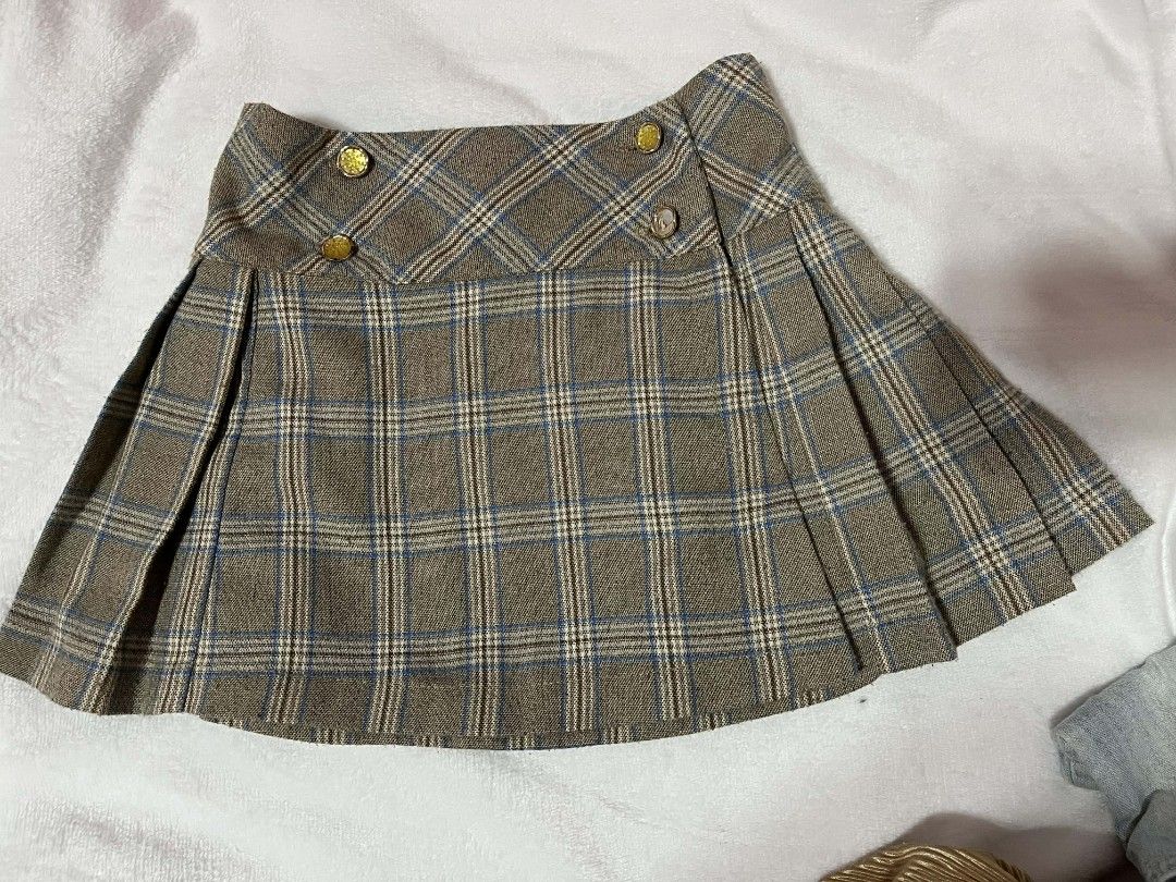 Kids Plaid Pleated Skirt (Category: Babies & Kids Fashion) located in Valenzuela. Submitted by senia09 (Listing ID 1412164376, Image 2). Description: - Plaid mini skirt - Pleated design - Button detail - Neutral color - Versatile for different outfits.