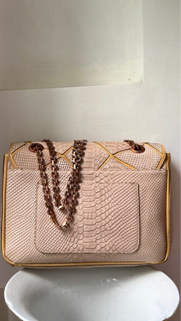 Lanvin Python Leather Shoulder Bag (Category: Luxury Bags & Wallets) located in Malolos. Submitted by flapnbloom.ph (Listing ID 1412163081, Image 2). Description: - Python leather shoulder bag - Geometric design - Chain strap, Rosegold, shoulder only, not convertible - Interior zippered pocket - Clasp flap closure - Lanvin logo on interior zipper pull - Discounted price due to signs of storage but bag is lighyly used.