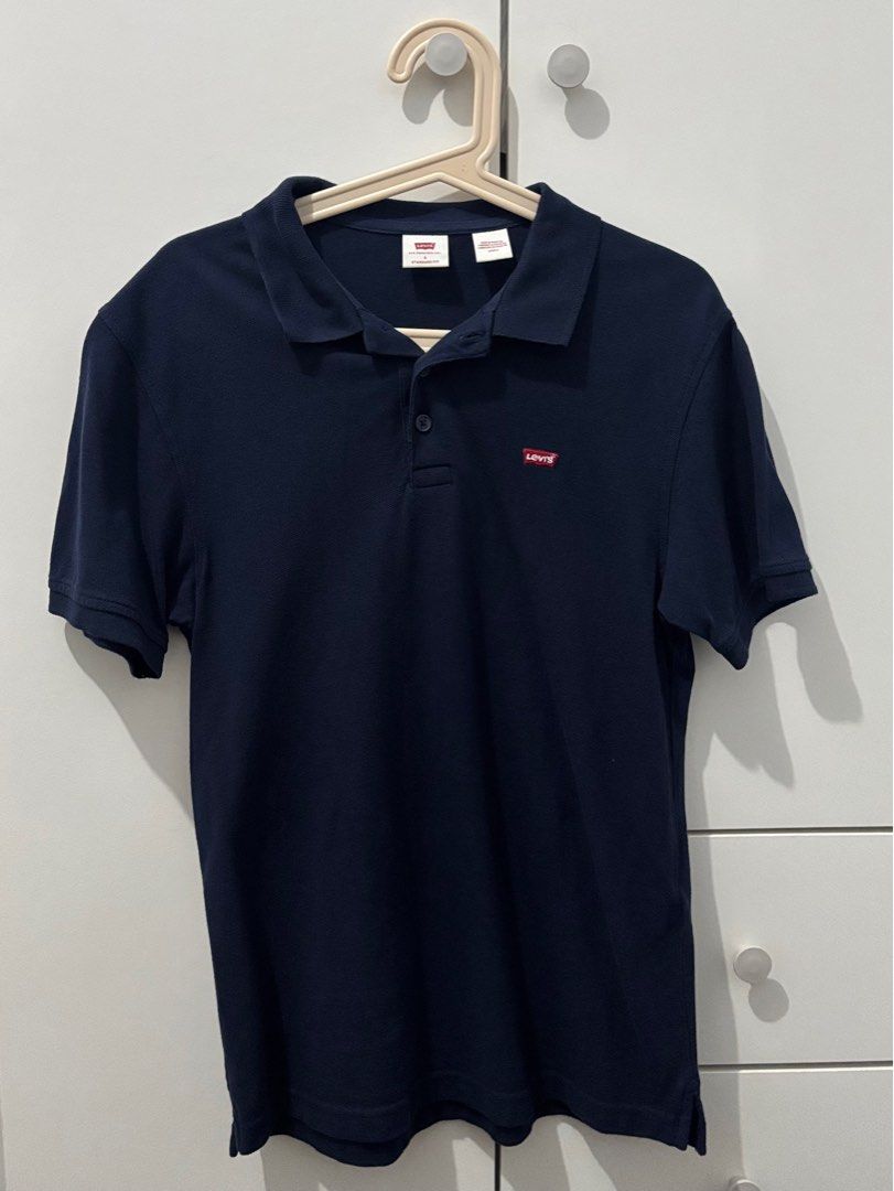 Levi's Navy Blue Polo Shirt (Category: Tshirts & Polo Shirts ) located in Manila. Submitted by decluttaro (Listing ID 1412282590, Image 1). Description: - Navy blue Levi's polo shirt - Classic polo collar and short sleeves - Features a three-button placket - Levi's logo on the chest RFS: DECLUTTERING USED ONCE ONLY.