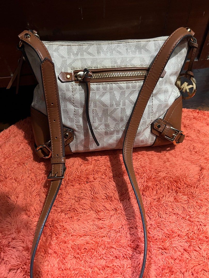 Limited, AuthenticMichael Kors Med messenger Bag (Category: Luxury Bags & Wallets) located in Quezon City. Submitted by sherashley (Listing ID 1412221917, Image 1). Description: PRODUCT DETAILS Brand: Michael Kors Model: FALLON Exterior Color: cream w/combination or brown leather Size: Medium Bag Width: 11 inches Department: Women Style: Messenger / Shoulder Bag Bag Height: 9 inches Product Line: Michael Kors Fallon Pattern: MK Monogram Features: