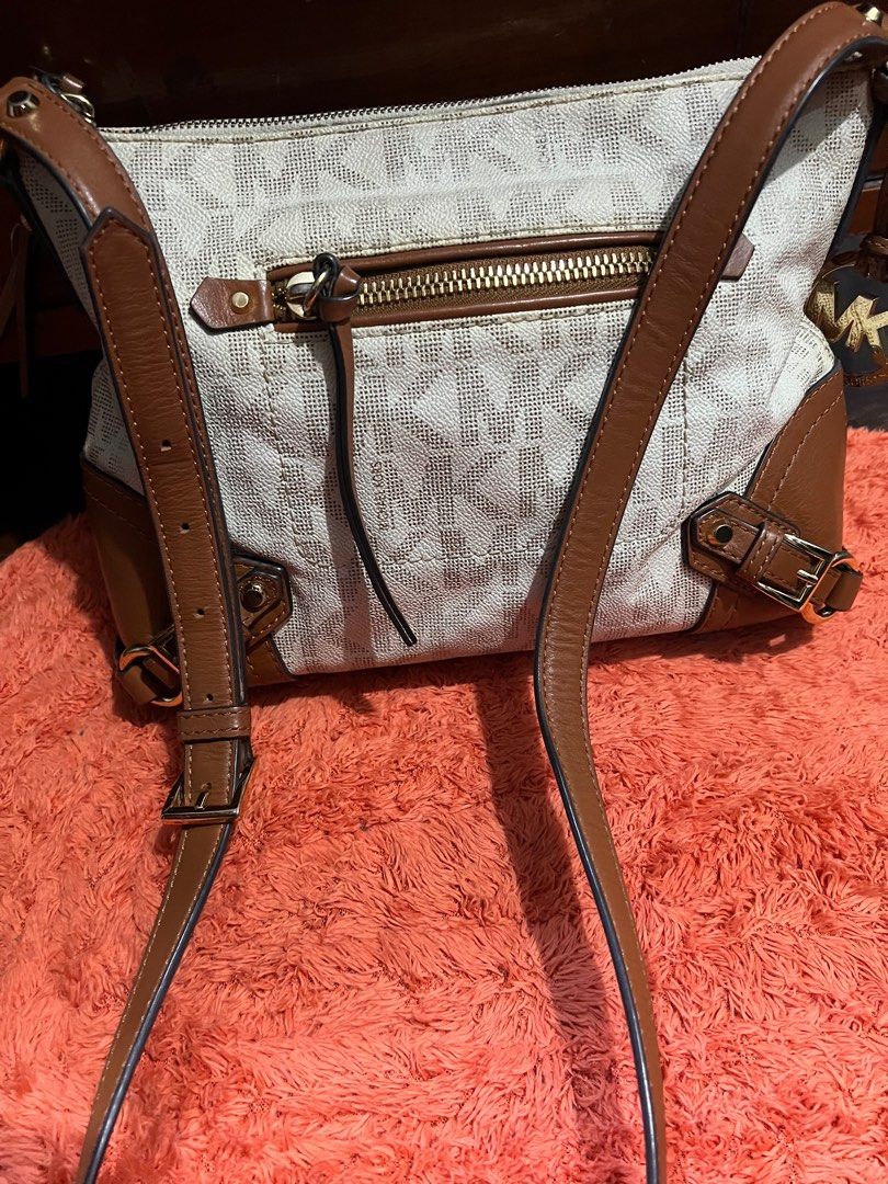 Limited, AuthenticMichael Kors Med messenger Bag (Category: Luxury Bags & Wallets) located in Quezon City. Submitted by sherashley (Listing ID 1412221917, Image 2). Description: PRODUCT DETAILS Brand: Michael Kors Model: FALLON Exterior Color: cream w/combination or brown leather Size: Medium Bag Width: 11 inches Department: Women Style: Messenger / Shoulder Bag Bag Height: 9 inches Product Line: Michael Kors Fallon Pattern: MK Monogram Features: