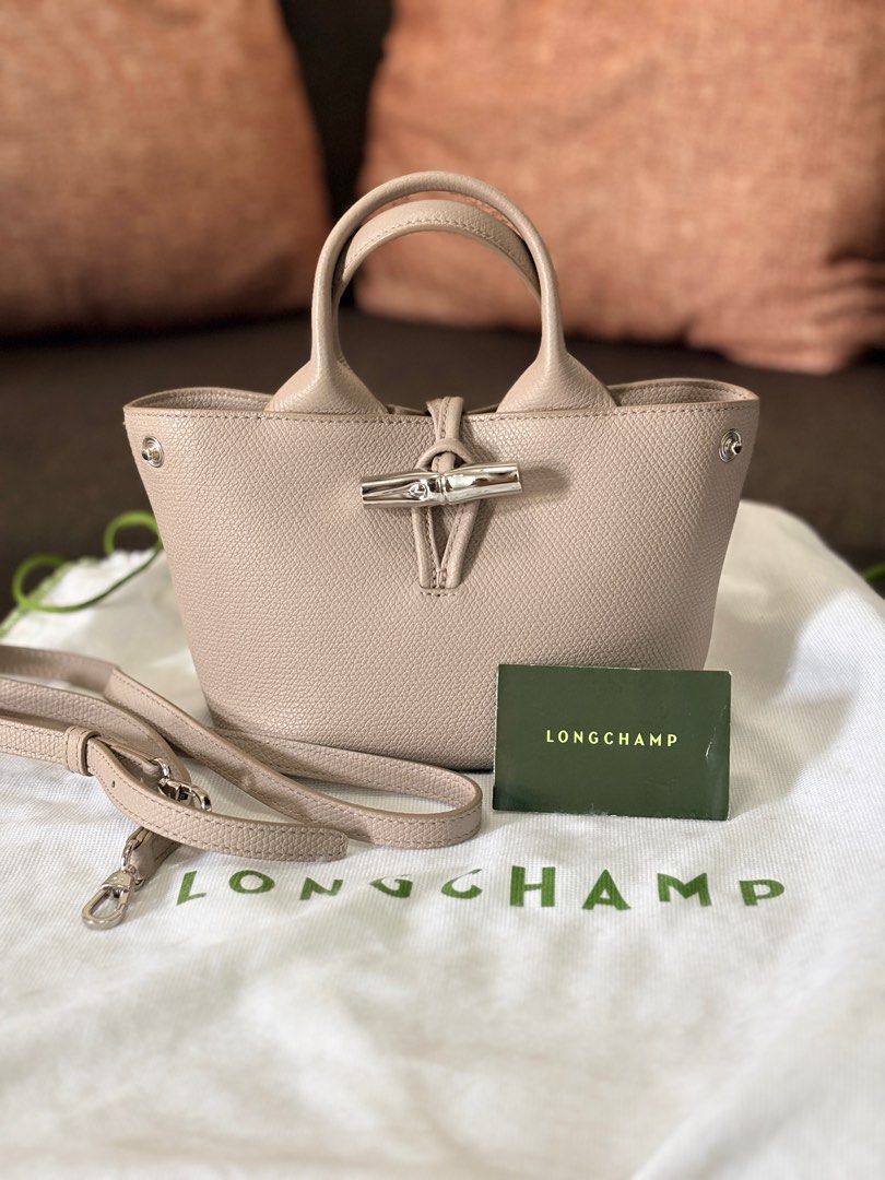 Longchamp Le Roseau Mini Top Handle Bag (Category: Luxury Bags & Wallets) located in Las Pinas. Submitted by joshdejos (Listing ID 1412191005, Image 1). Description: - Authentic Longchamp Le Roseau Mini Top Handle Bag (XS) - Clay colorway - Top handle and detachable shoulder strap - Includes original dust bag and card w/ original receipt from Longchamp Greenbelt branch - PHP 35,000 (Srp: 42,500). Slightly nego Condition: 10/10 Like new. Bag was b