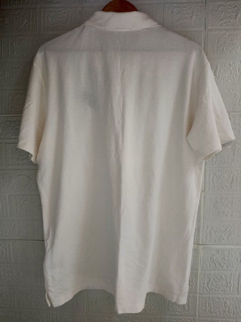 Louis Vuitton Polo Shirt - White (Category: Tshirts & Polo Shirts ) located in Goa. Submitted by kaye_dee (Listing ID 1412211985, Image 2). Description: - Authentic Louis Vuitton polo shirt - Color: White - Features the iconic Louis Vuitton logo - Size: XXL - Made in Italy - Classic polo collar and short sleeves - Includes washing instructions label - A stylish and timeless piece.