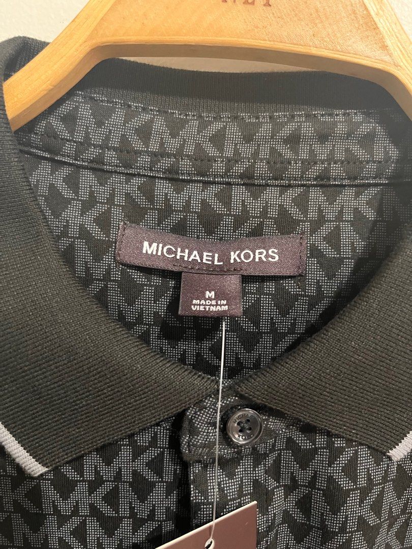 Michael Kors Black Polo Shirt Medium (Category: Tshirts & Polo Shirts ) located in Lipa City. Submitted by rcbuml (Listing ID 1412171240, Image 2). Description: Authentic Michael Kors Polo Shirt Brand New Black with all-over monogram Size Medium With Tag Bought in the US.