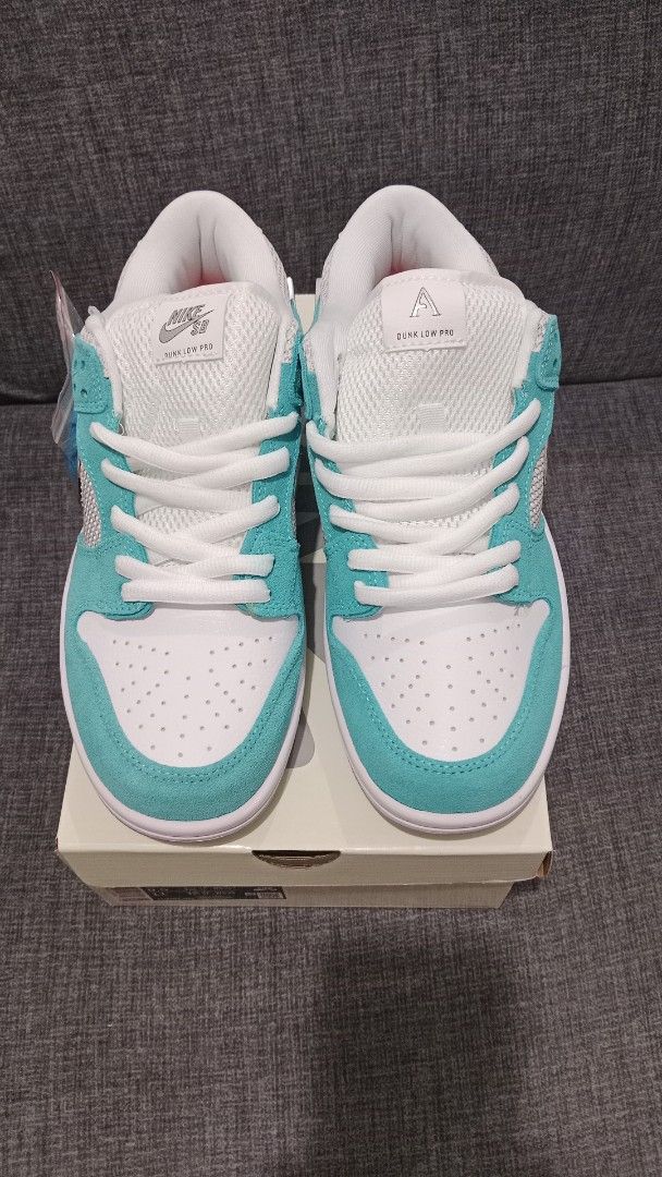 Nike SB Dunk Low Pro April Skateboards (Category: Sneakers) located in Valenzuela. Submitted by jannah528 (Listing ID 1412326486, Image 1). Description: - Nike SB Dunk Low Pro April Skateboards - Size: US 9.5 / EUR 43 / CM 27.5 - Colorway: White and Teal - Features a silver swoosh - Includes original box - Comes with an extra pair of blue laces - "April" branding on the heel.