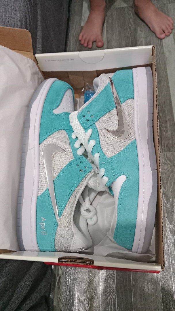 Nike SB Dunk Low Pro April Skateboards (Category: Sneakers) located in Valenzuela. Submitted by jannah528 (Listing ID 1412326486, Image 2). Description: - Nike SB Dunk Low Pro April Skateboards - Size: US 9.5 / EUR 43 / CM 27.5 - Colorway: White and Teal - Features a silver swoosh - Includes original box - Comes with an extra pair of blue laces - "April" branding on the heel.