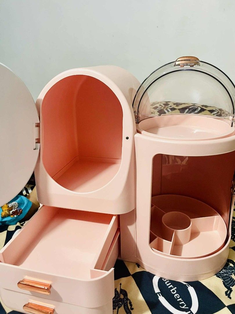 Pink LED Lighted Makeup Organizer (Category: Makeup) located in Quezon City. Submitted by jobertcordova90 (Listing ID 1412286798, Image 2). Description: - Pink makeup organizer - Built-in LED lighted mirror - Multiple storage compartments - Two drawers - Clear dome lid section - Compartment with a door - Tray with dividers - Keeps cosmetics organized and accessible.