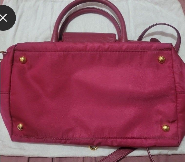 Prada Handbag with Shoulder Strap (Category: Luxury Bags & Wallets) located in Makati City. Submitted by pinkmask (Listing ID 1412151968, Image 3). Description: Preloved ♥️ Authentic Prada Ibisco Tessuto Nylon and Saffiano Leather Tote Bag BN2106. RFS: Decluttering MOP: GCash/ Online banking --BDO or Security Bank (Cash or Cashless Transaction) 💳.