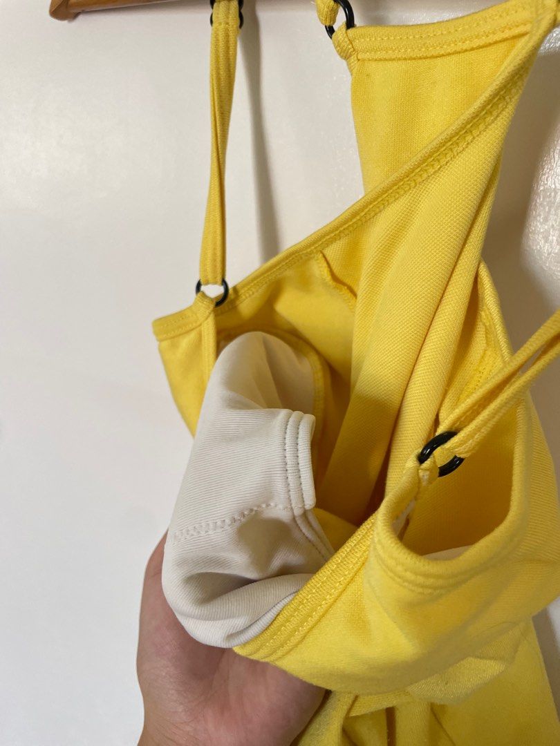 Puma Yellow Tank Top (Category: Sleeveless) located in Cavite. Submitted by _nicoffee (Listing ID 1412193925, Image 3). Description: - Bright yellow Puma tank top with black trim - Adjustable straps - Racerback design - Puma logo on the back -Bust: 25-28in Length: 19-20in Does not fit me anymore, see last photo for worn pic.