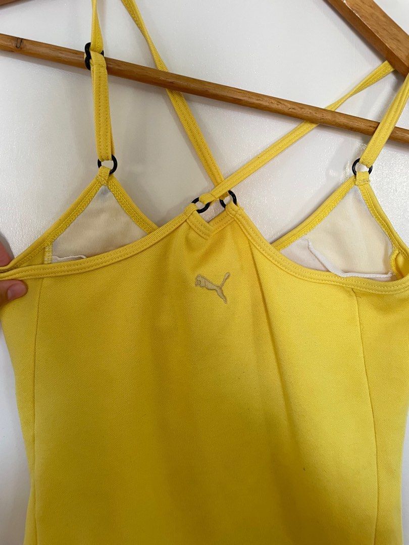 Puma Yellow Tank Top (Category: Sleeveless) located in Cavite. Submitted by _nicoffee (Listing ID 1412193925, Image 2). Description: - Bright yellow Puma tank top with black trim - Adjustable straps - Racerback design - Puma logo on the back -Bust: 25-28in Length: 19-20in Does not fit me anymore, see last photo for worn pic.