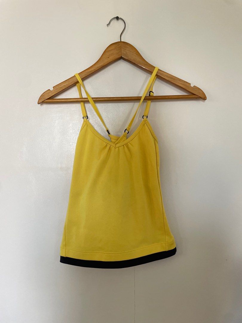 Puma Yellow Tank Top (Category: Sleeveless) located in Cavite. Submitted by _nicoffee (Listing ID 1412193925, Image 1). Description: - Bright yellow Puma tank top with black trim - Adjustable straps - Racerback design - Puma logo on the back -Bust: 25-28in Length: 19-20in Does not fit me anymore, see last photo for worn pic.