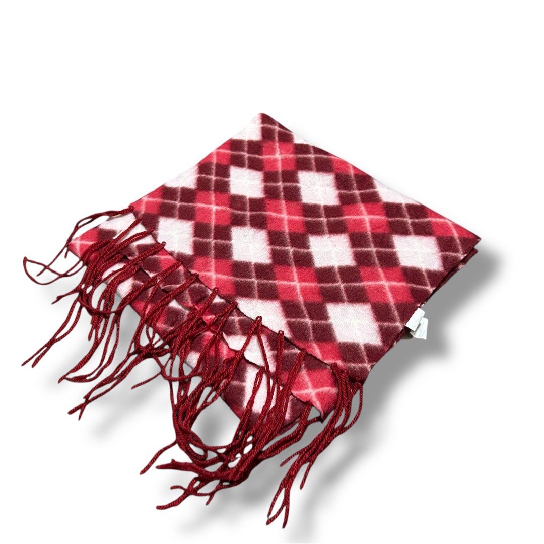 Red and Pink Argyle Fleece Scarf (Category: Scarves) located in Cabuyao City. Submitted by joaquinb18 (Listing ID 1412311382, Image 1). Description: Red and Pink Argyle Fleece Scarf Pattern: A repeating diamond motif that covers the entire length of the fabric. Fringe: The ends are finished with self-fringe (tassels made from the same yarn or fabric as the scarf) in a solid burgundy color. Construction: It is a rectangular “muffler” style scarf, 