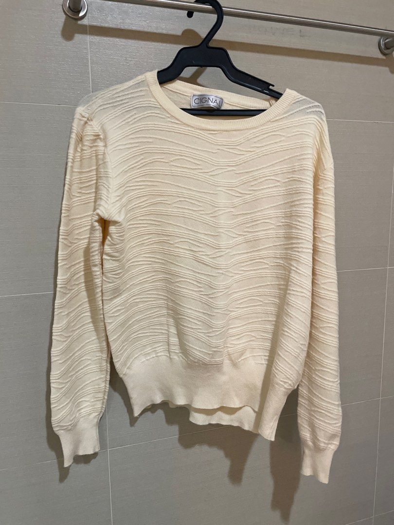 Rustans Cignal Textured Knit Sweater in Off White (Category: Longsleeves) located in Mandaluyong City. Submitted by beautyfashdeclutter (Listing ID 1412225659, Image 1). Description: - Cream-colored sweater - Brand: Cignal - Textured knit design - Crew neck - Long sleeves - Ribbed cuffs and hem - Brand label visible.
