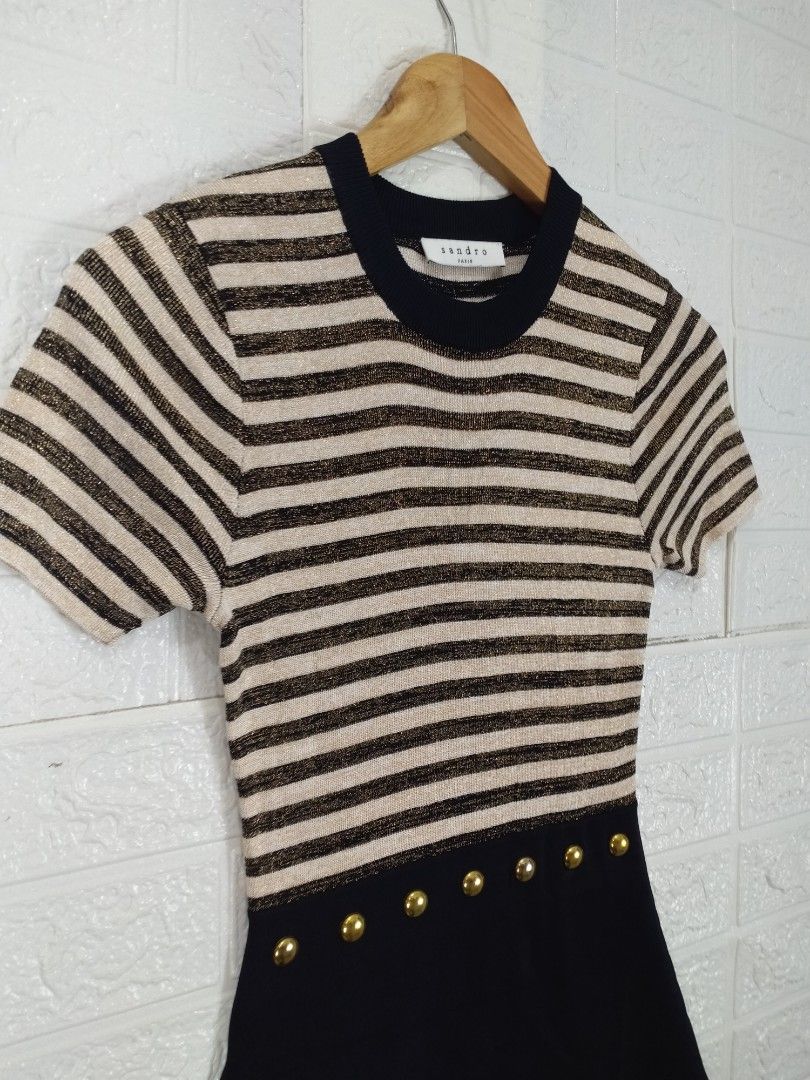 Sandro Paris Striped Dress (Category: Luxury Apparel) located in Baguio. Submitted by dansteals (Listing ID 1412282465, Image 3). Description: - Sandro Paris dress - Striped top with a solid black skirt - Features short sleeves - Gold-colored buttons at the waist - Round neckline - Made in France Length: 33 Width: 14 Waist: 24.