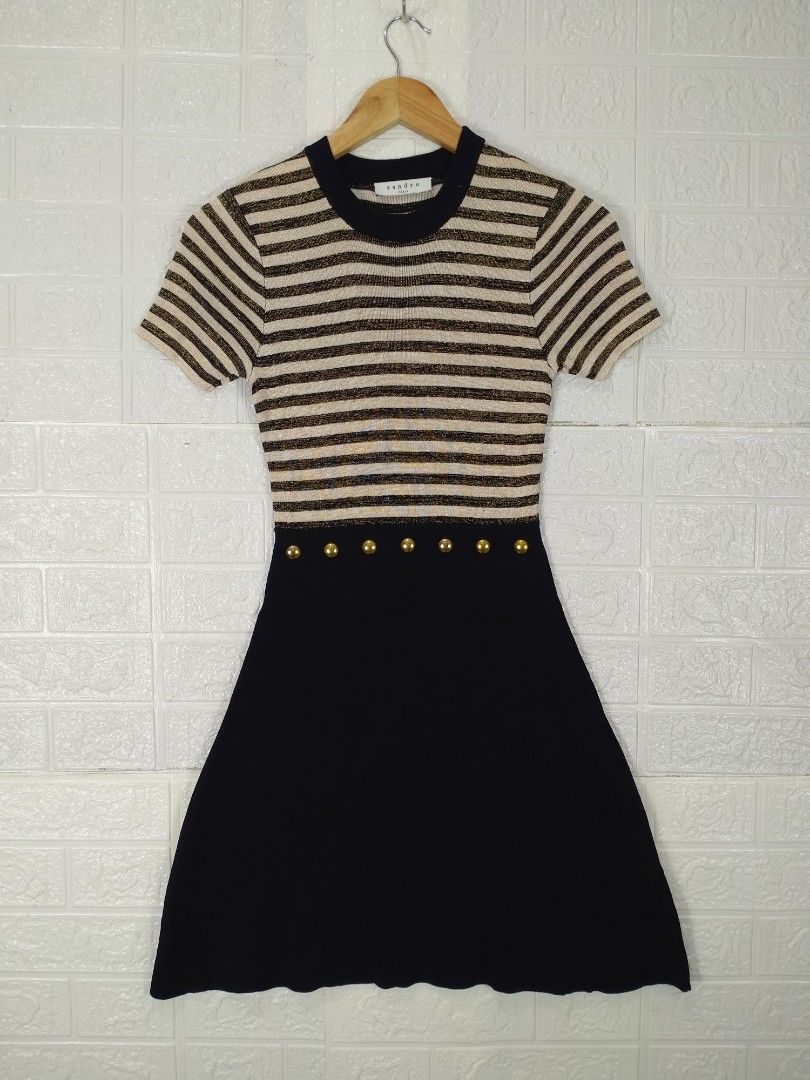 Sandro Paris Striped Dress (Category: Luxury Apparel) located in Baguio. Submitted by dansteals (Listing ID 1412282465, Image 1). Description: - Sandro Paris dress - Striped top with a solid black skirt - Features short sleeves - Gold-colored buttons at the waist - Round neckline - Made in France Length: 33 Width: 14 Waist: 24.