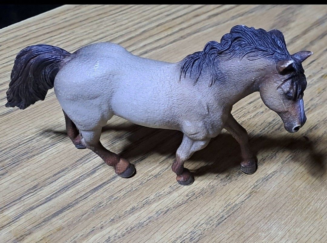 Schleich Horse Figure (Category: Figurines & Statues) located in Davao. Submitted by bravemoon_556cd5 (Listing ID 1412179908, Image 1). Description: - Schleich horse figure - Light grey body - Dark mane and tail - Made of durable plastic - Highly detailed features - Features the Schleich logo - Perfect for collectors.