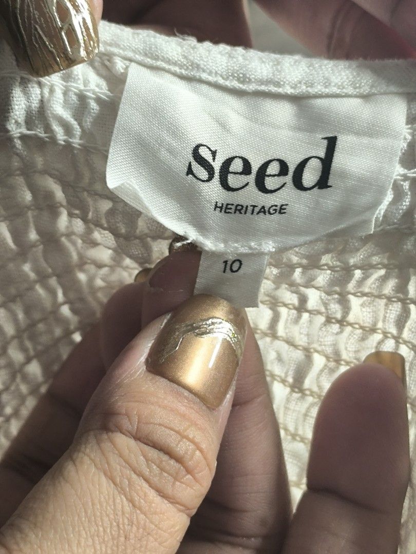 Seed Heritage White Crop Top - Medium (Category: Others Tops) located in Marikina City. Submitted by vaughnify (Listing ID 1412304799, Image 2). Description: Seed Heritage crop top blouse - Dirty White color - Size 10, Medium - V-neckline - Long sleeves with gathered cuffs - Twisted knot detail - Lightweight fabric -no flaws, like new 📍 Location: Marikina City 🚚 Courier Options: 🛍️ J&T Express • 2–3 days within Metro Manila • 3–5 days outside 
