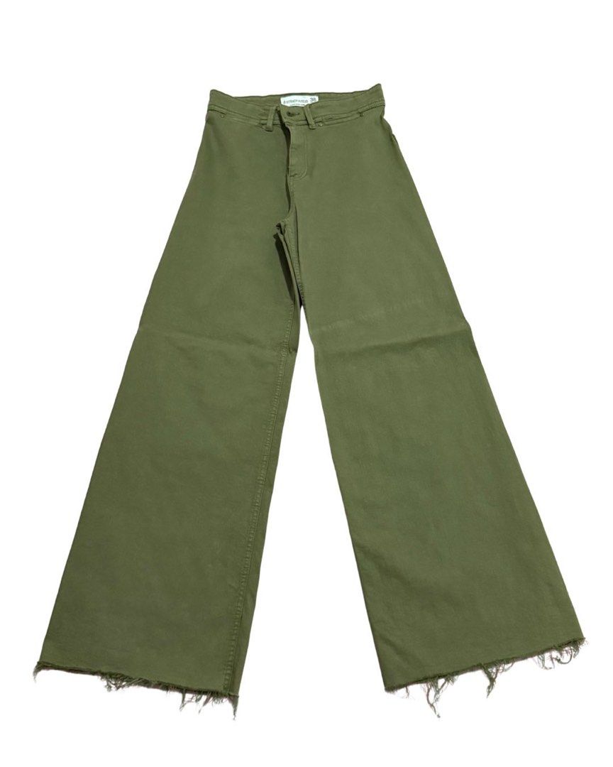 Stradivarius Wide Leg Jeans (Category: Jeans) located in Malabon City. Submitted by decluttergyal (Listing ID 1412156776, Image 1). Description: - I’m a 27 and this fits me perfectly. Height is 5’5 and this falls below my ankles - Worn once to work - Green wide-leg jeans - Button and zipper closure - Raw hem detail - Durable fabric - Comfortable and stylish - Versatile addition to your wardrobe.